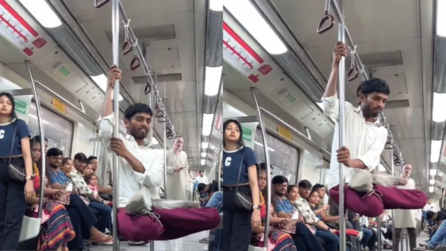 man-pole-stunt-in-delhi-metro-gets-divided-reactions-video-goes-viral-watch